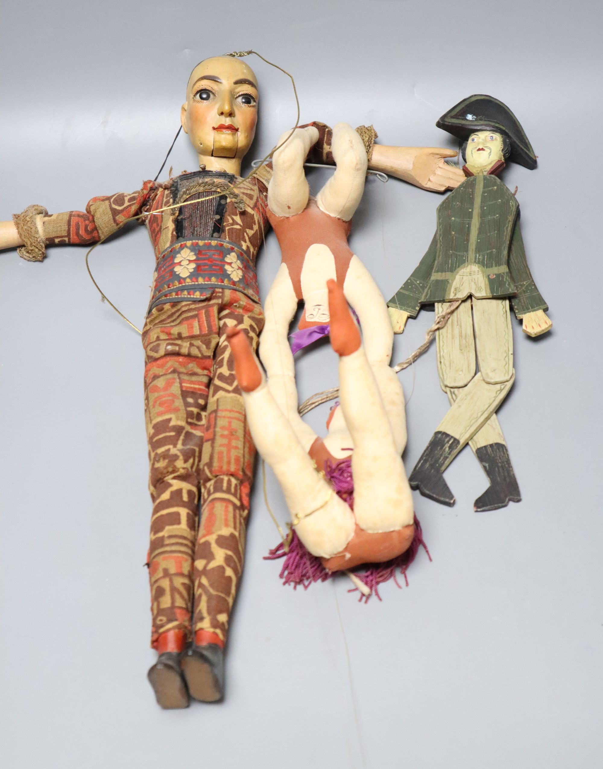 A Spanish / South American articulated marionette and two other toys